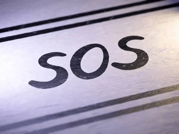 "sos "sobre papel — Fotografia de Stock