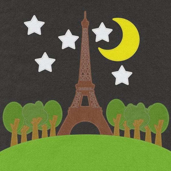 Torre Eiffel, París. Francia en estilo de puntada sobre fondo de tela —  Fotos de Stock