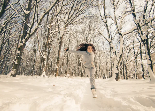 Active woman at winter forest — Stock Photo, Image