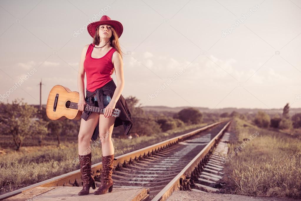 Artistic woman with guitar