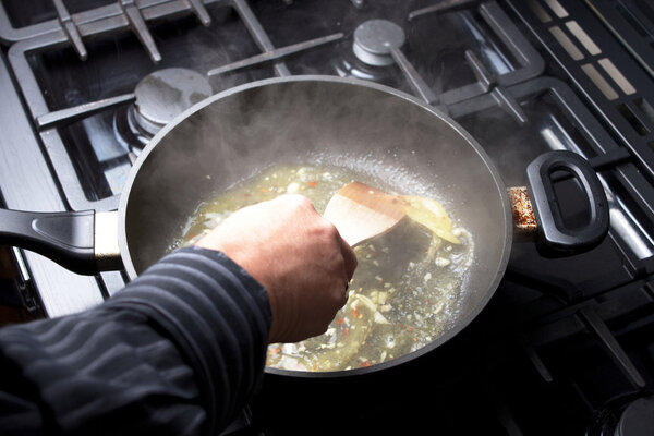 making sauce in a pan