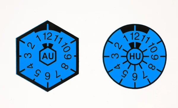 TÜV-seal and AU-badge Stock Picture