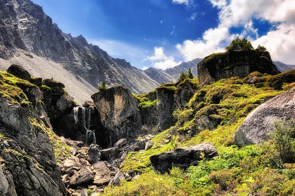 Mountain landscape with a small waterfall — Stock Photo, Image