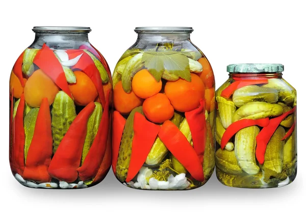 Assorted vegetables in glass jars — Stock Photo, Image