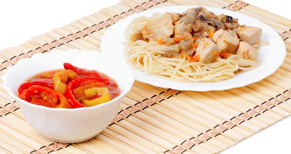 Italian spaghetti and appetizer bell peppers — Stock Photo, Image