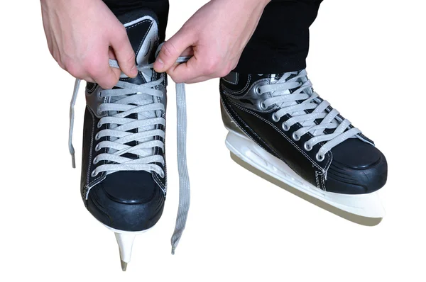 Tying laces on hockey skates — Stock Photo, Image