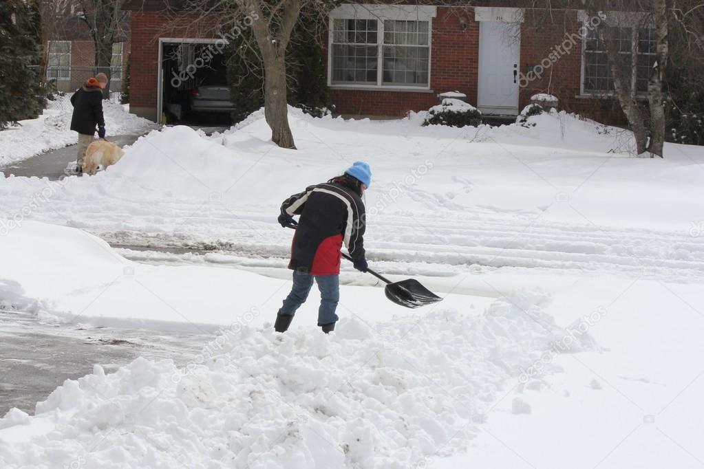 Lady Shoveling Snow from Driveway Stock Photo by ©huggy1 44704199