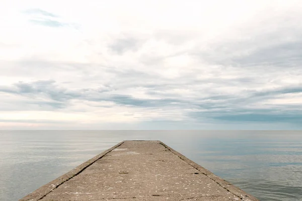 Empty Concrete Pier Sea Dramatic Sky Calm Water Abandoned Industrial — ストック写真