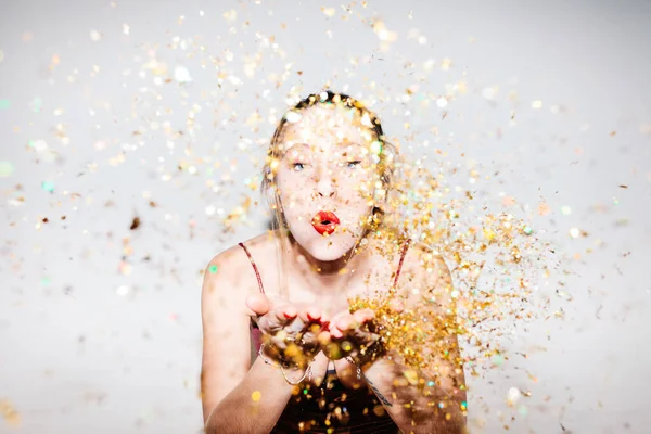 Young woman celebrating her 21st birthday illuminated with hard flash light. high key photography — Stock Photo, Image