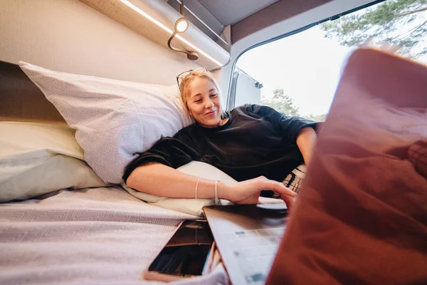 Glad Young Woman Pajama Smiling Looking Camera While Sitting Bed Stock Image