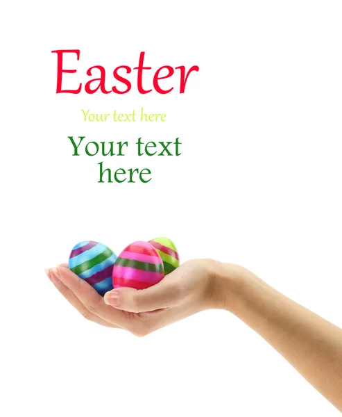 Female hand holding three colorful Easter eggs — Stock Photo, Image