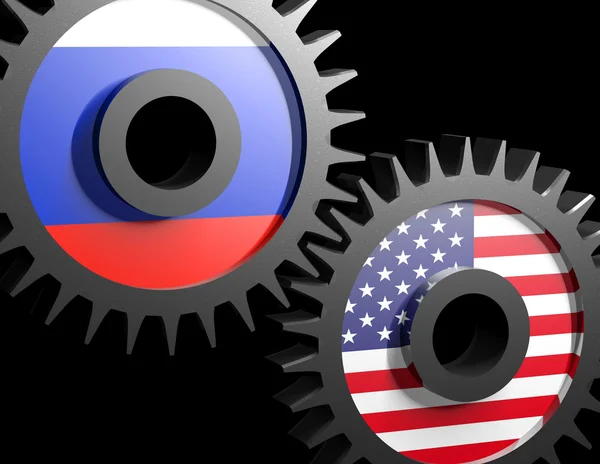 Две шестерни с флагами США и России — стоковое фото