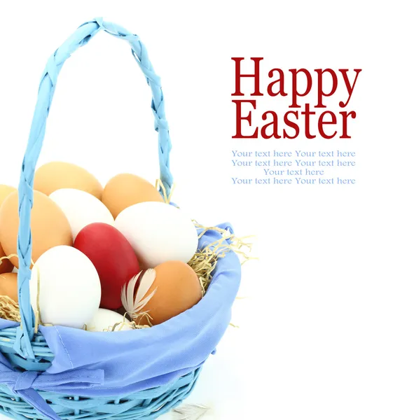 Red Easter egg among fresh eggs in the basket — Stock Photo, Image