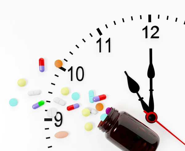 Uhr und Tabletten kommen aus der Medikamentenflasche — Stockfoto