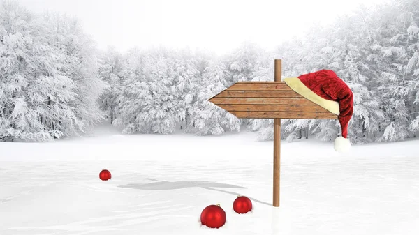 Wooden sign with Santa hat on snowy field — Stock Photo, Image