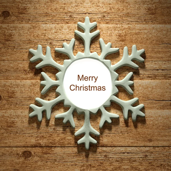 Christmas snowflake on wooden background — Stock Photo, Image