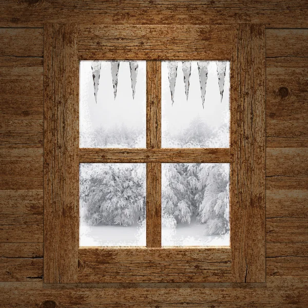 Ahşap pencere gözden kaçırmak, kar kaplı ağaçlar — Stok fotoğraf