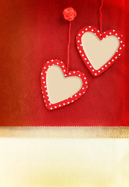 Heart ornament hanging on vintage fabric background — Stock Photo, Image