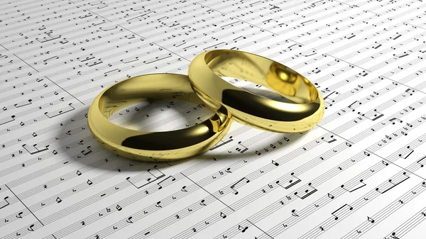 Anillos de boda en música notas de fondo —  Fotos de Stock