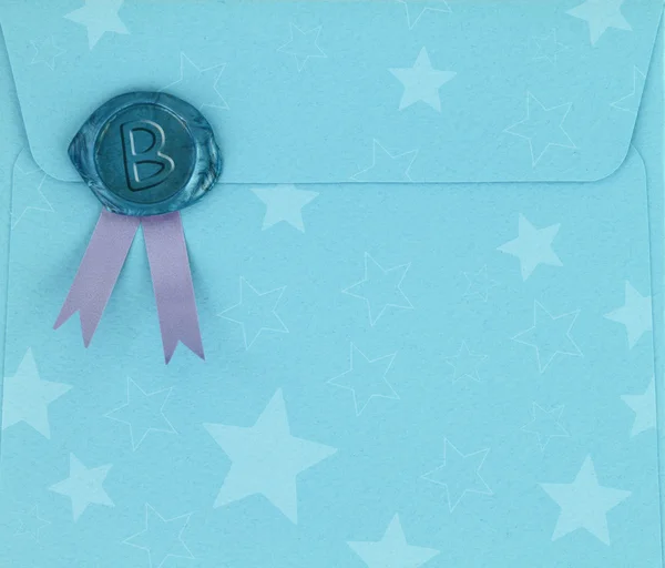Blue envelope with sealing wax stamp — Stock Photo, Image