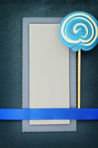 蓝色背景上的棒棒糖空白横幅 — 图库照片