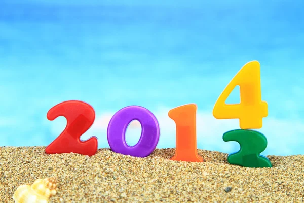 Multicolored new year 2014 on the beach — Stock Photo, Image