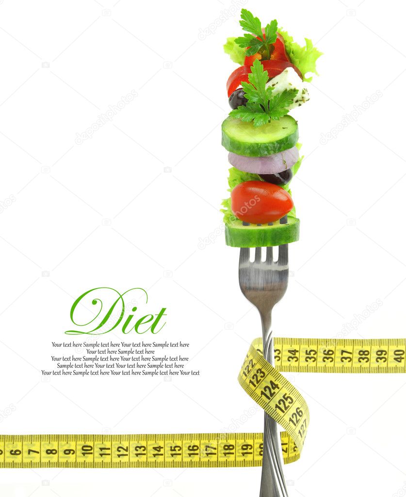 Fresh mixed vegetables on fork with measuring tape