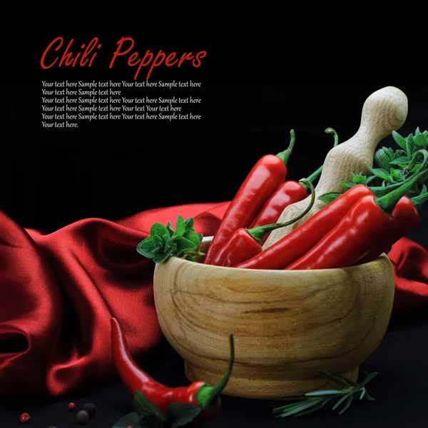 Red hot chili peppers with herbs in wooden — Stock Photo, Image