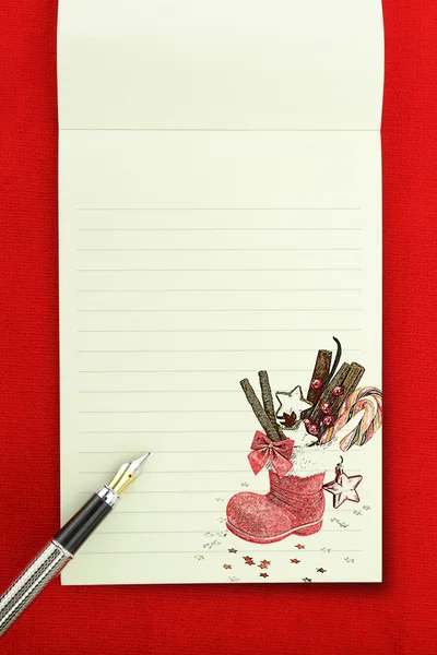 Notebook de Natal em fundo vermelho — Fotografia de Stock