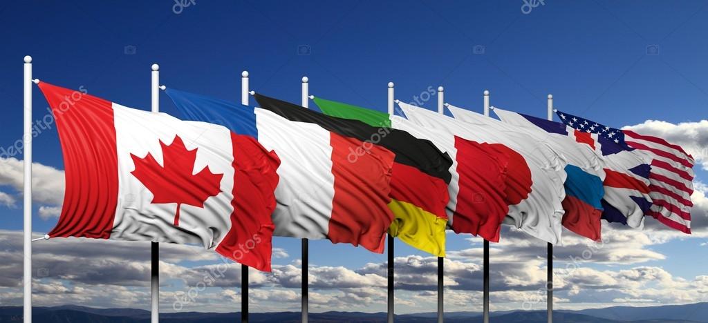 flags of g8 members against blue sky