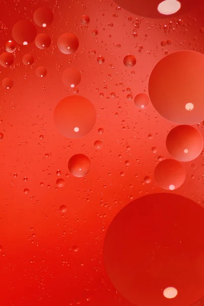 Abstract red background with bubbles in the water — Stock Photo, Image