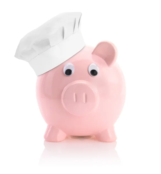 Cooking economy represented by a piggy bank with a chef hat — Stock Photo, Image