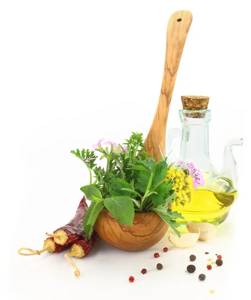 Fresh herbs and spices in wooden spoon — Stock Photo, Image