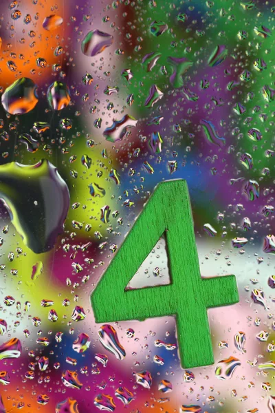 Number four on abstract colorful drops background — Stock Photo, Image