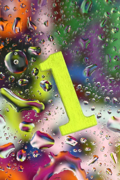 Number one on abstract colorful drops background — Stock Photo, Image