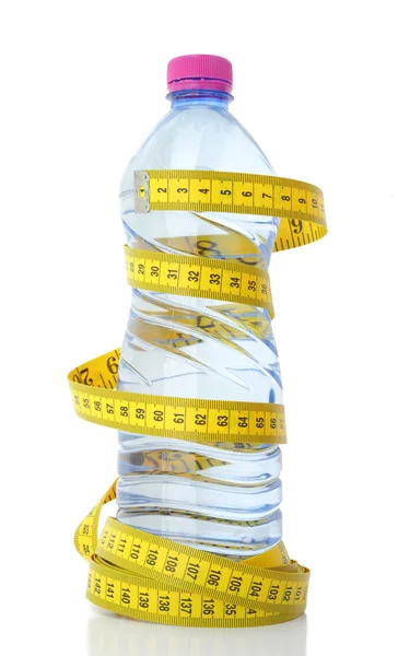 Plastic bottle of water with measuring tape — Stock Photo, Image