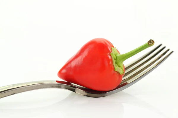 Red hot mini chili pepper on fork, isolated on white — Stock Photo, Image