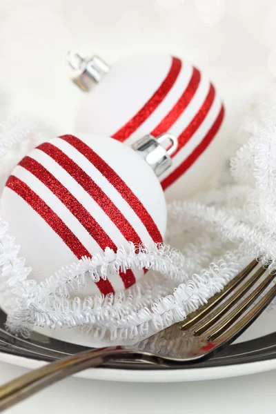 Christmas table setting with ornament on a plate — Stock Photo, Image