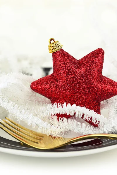 Christmas table setting with ornaments on a plate — Stock Photo, Image