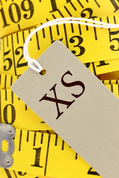 Measuring tape closeup with size tag — Stock Photo, Image