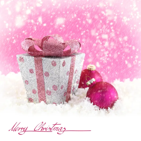 Present box with Christmas balls and snow — Stock Photo, Image