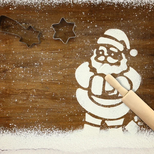 Concepto para hornear con Santa Claus y nieve hecha de harina — Foto de Stock
