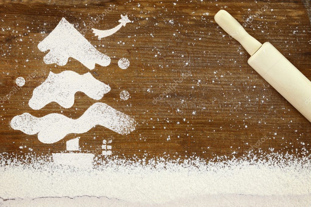 Concept for baking with snowy Christmas tree made of flour