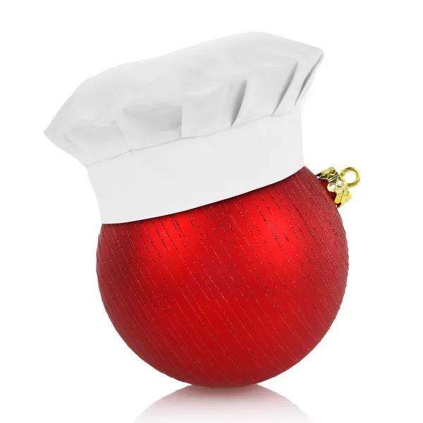 Kuchař klobouk na elegantní vánoční koule izolovaných na bílém pozadí — Stock fotografie