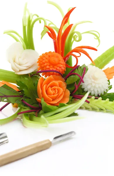 Decorative flowers carved from vegetables with carving knives isolated — Stock Photo, Image