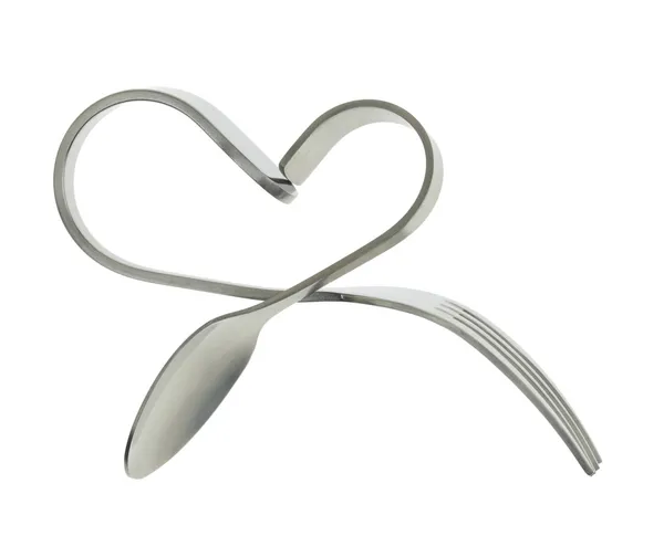 Widelec i łyżka zgięty w kształcie serca, na białym tle — Zdjęcie stockowe