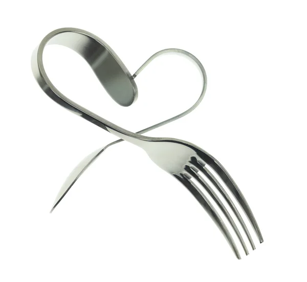 Fork and spoon bent in shape of heart isolated — Stock Photo, Image