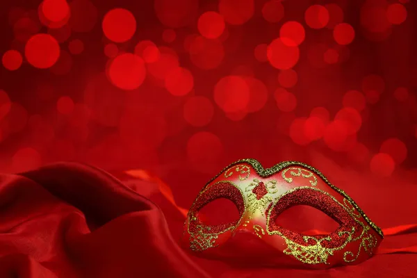 Vintage venetian carnival mask on red background — Stock Photo, Image