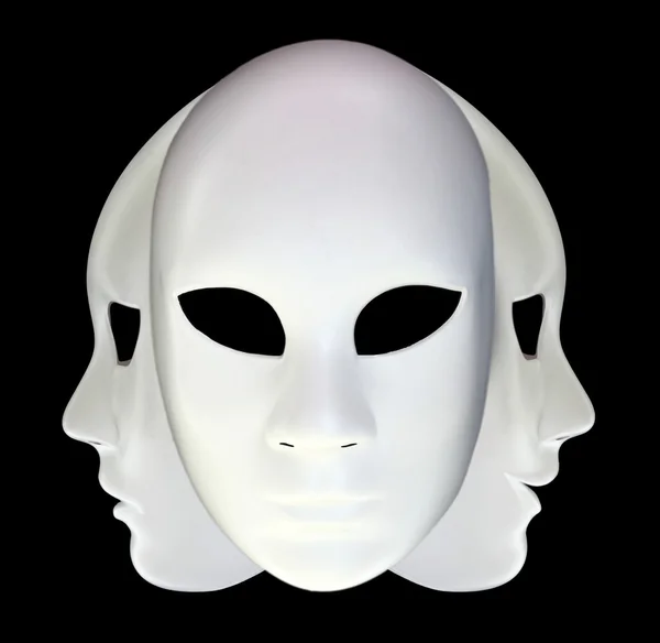 Weiße Masken auf schwarzem Hintergrund — Stockfoto