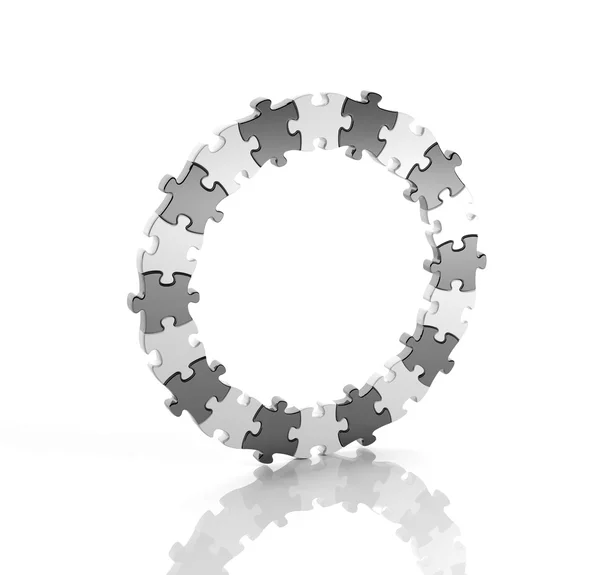 Peças de quebra-cabeça preto e branco em um círculo isolado — Fotografia de Stock